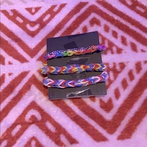 Three rubber band bracelets
